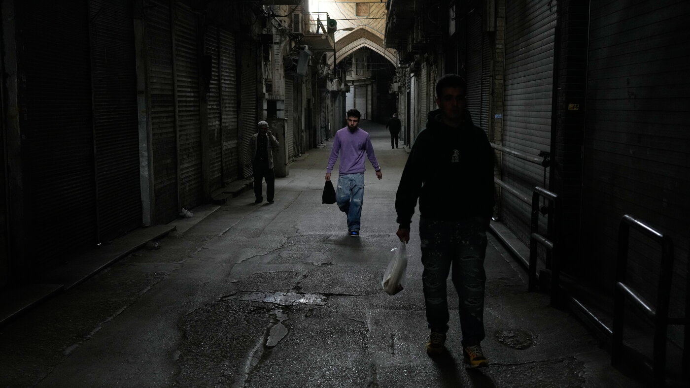 Amid war and sanctions, many Iranians are losing their jobs and struggling to get by
